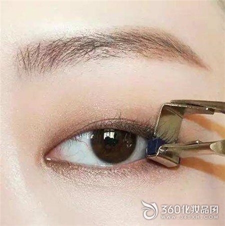 The moment the eyelash curler is clipped to the eyelid