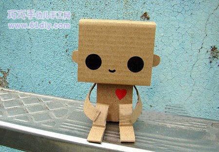 Cute little doll made of waste cardboard 2