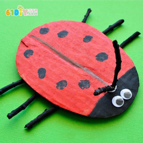 Waste cardboard branches making spring ladybug