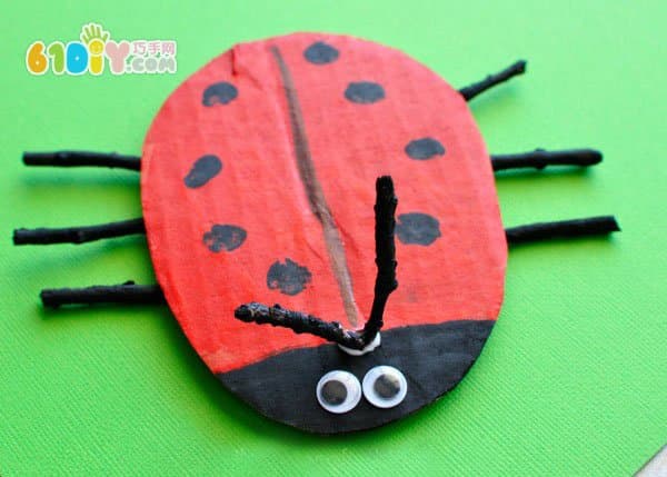 Waste cardboard branches making spring ladybug