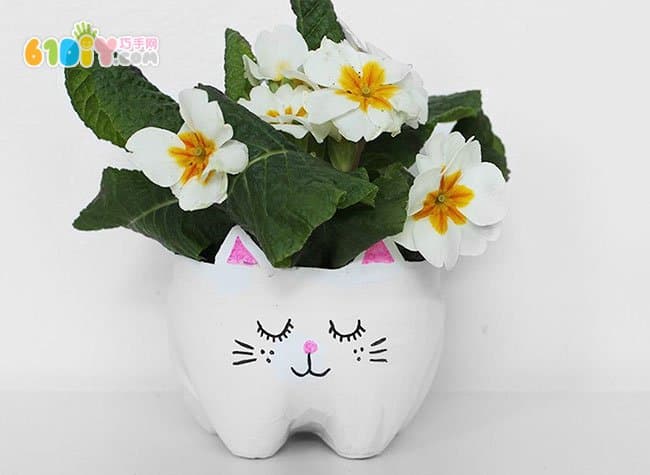 Coke bottle turned into cute kitten flowerpot