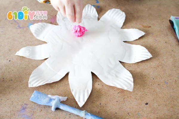 Children making spring colorful flowers