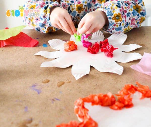 Children making spring colorful flowers