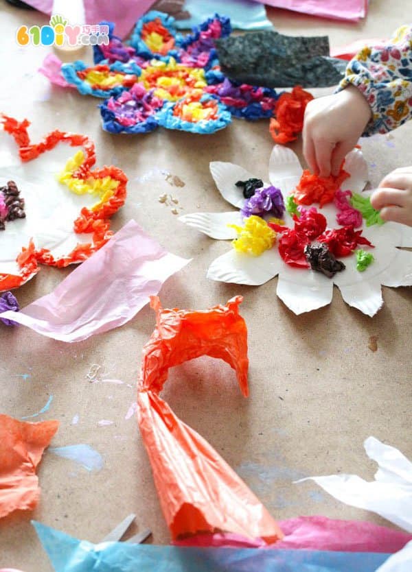 Children making spring colorful flowers