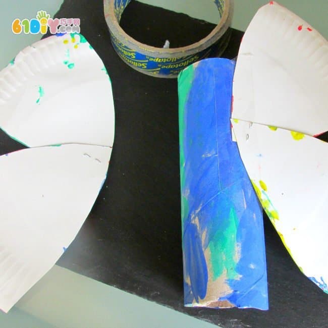 Children make colorful butterflies using paper trays