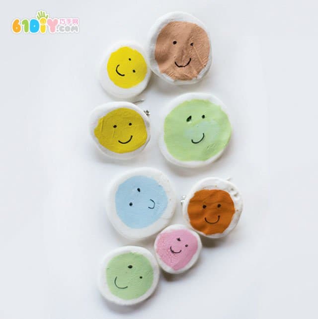 Children's handmade clay smiley badge