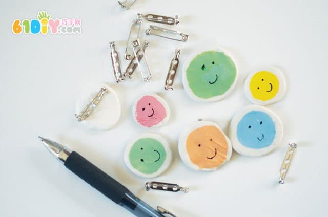 Children's handmade clay smiley badge