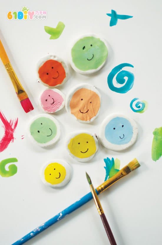 Children's handmade clay smiley badge