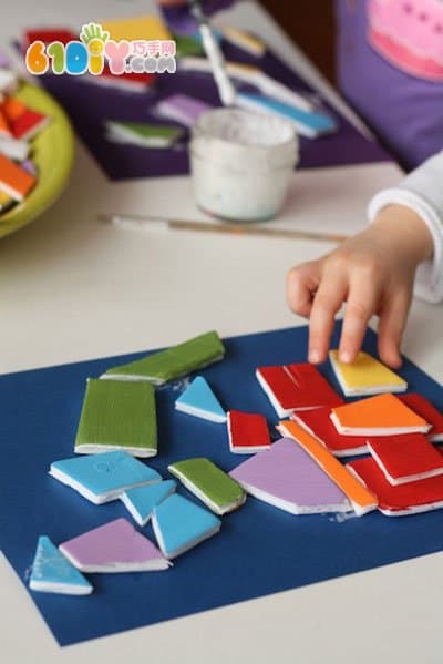 Young children make art paintings using waste lunch boxes