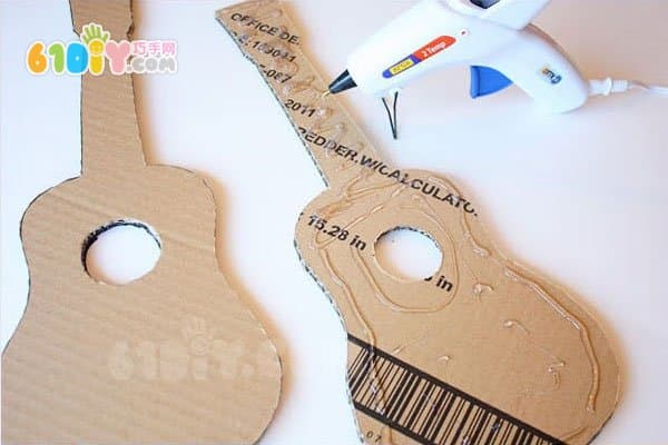Waste cardboard making toy guitar