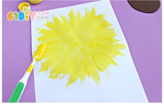 Child painting toothbrush painting sunflower