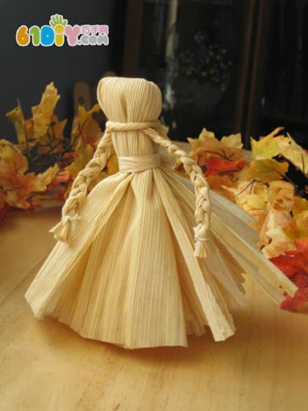 Handmade simple doll with corn leaves