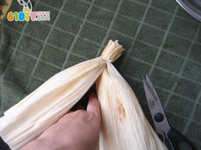 Handmade simple doll with corn leaves