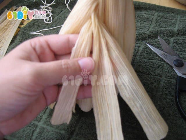 Handmade simple doll with corn leaves