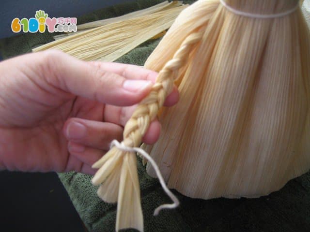 Handmade simple doll with corn leaves