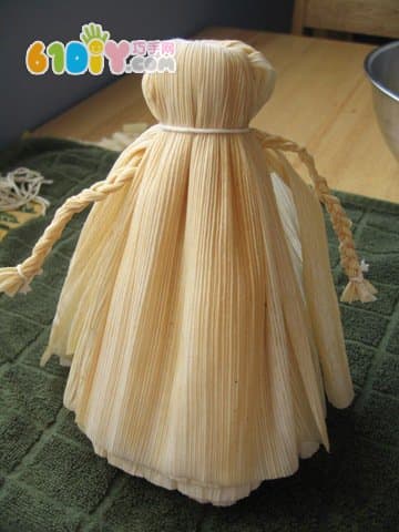 Handmade simple doll with corn leaves