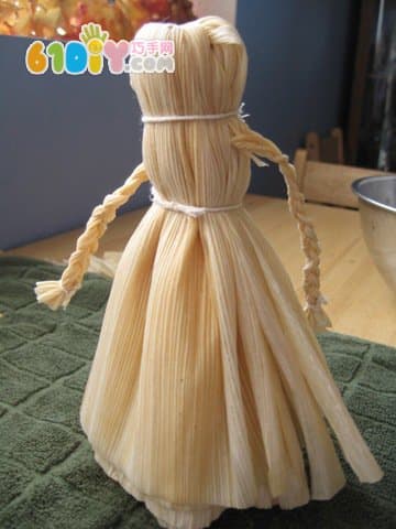 Handmade simple doll with corn leaves