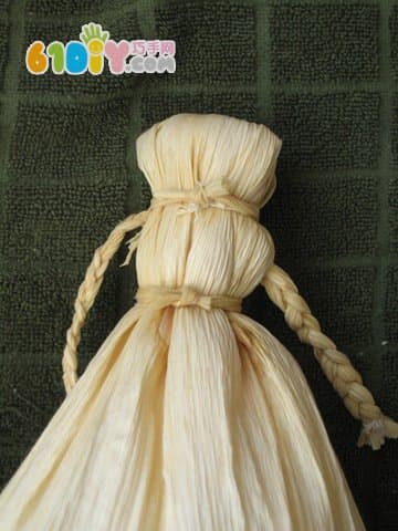 Handmade simple doll with corn leaves