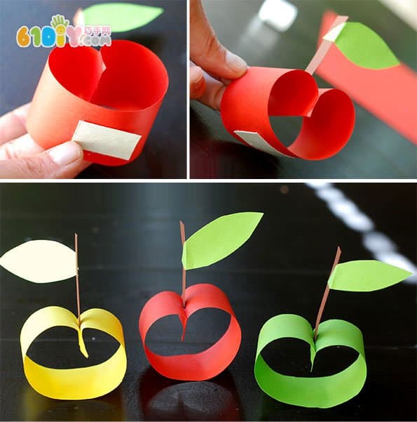 Child making stereo cardboard apple