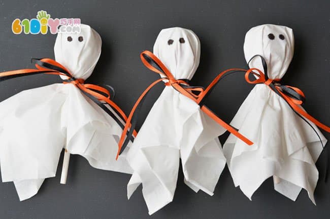 Parent-child making Halloween lollipop ghost