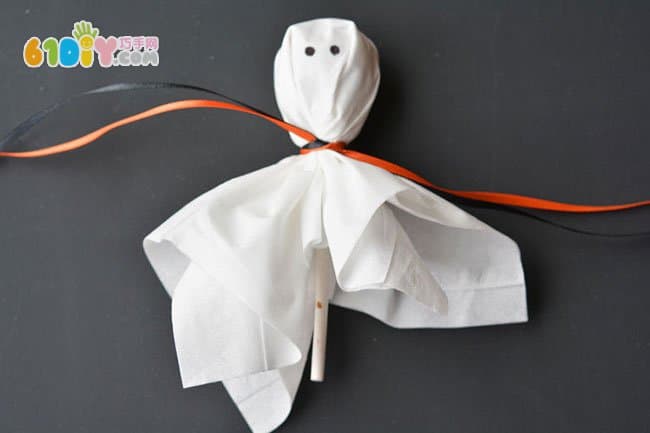 Parent-child making Halloween lollipop ghost