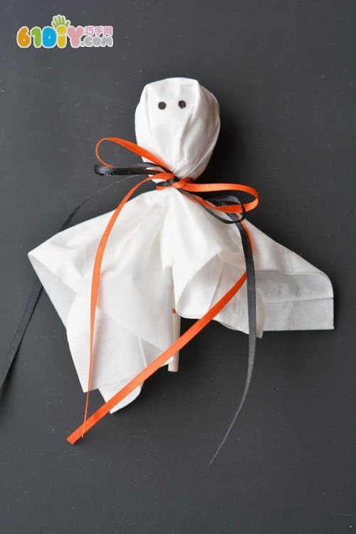 Parent-child making Halloween lollipop ghost