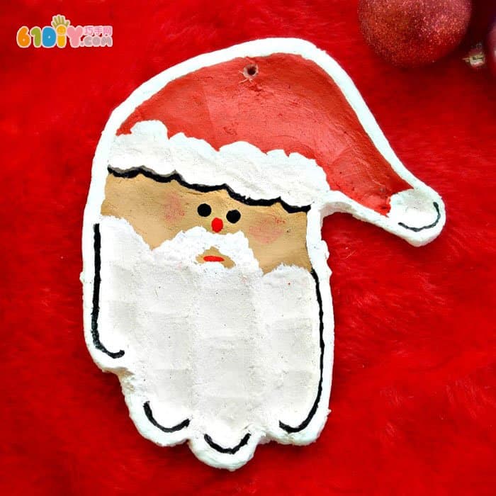 Salt dough making cute handprint Santa Claus