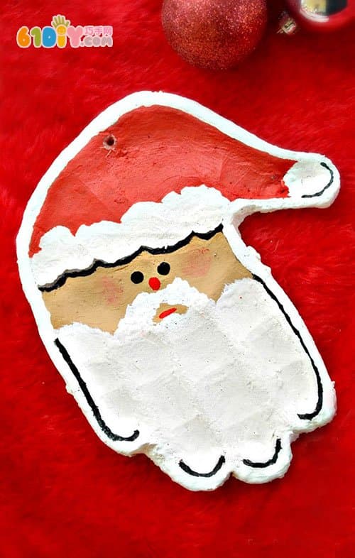 Salt dough making cute handprint Santa Claus