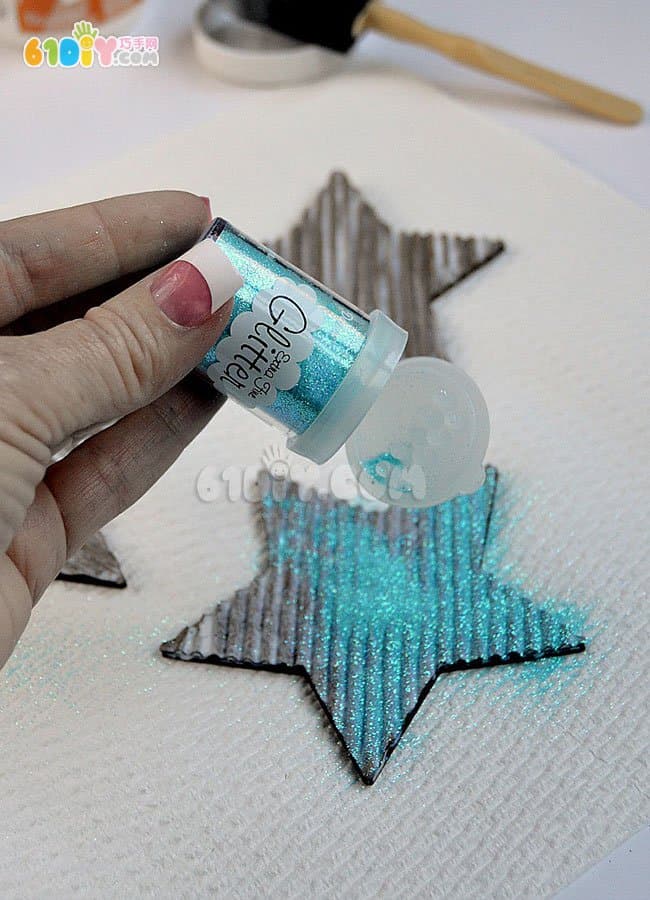 Children making Christmas shiny star ornaments