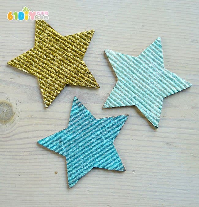 Children making Christmas shiny star ornaments