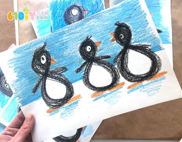 Child painting cute little penguin