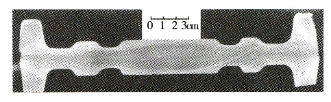 Figure 1 Typical folding of a die forging (low magnification)