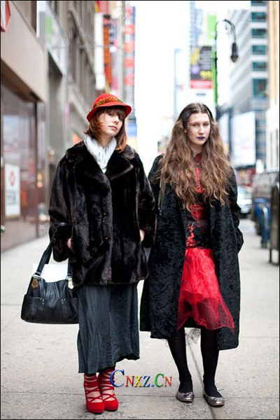 Red trench coat studded with red Chanel plaid handbag