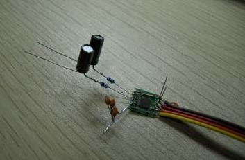 Then solder on the capacitors, these two electrolytics are the coupling capacitors for the two-channel output