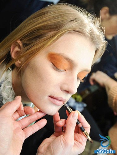 Dries Van Noten show orange eye makeup