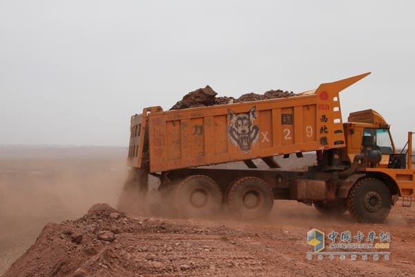 The "Northwestern Wolf" car dumped 30 tons of muck on the edge of an almost vertical cliff. The cliff is the Gobi Desert.