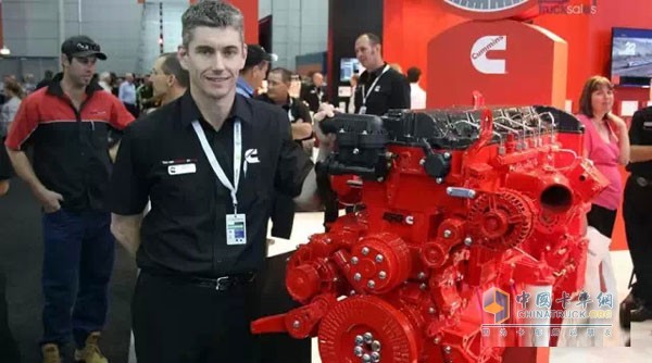 Cummins staff photo with Cummins ISG engine