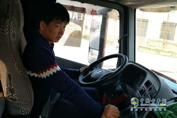 Wei Kai in the driver's cab of the Daimler Daimler Fukuda