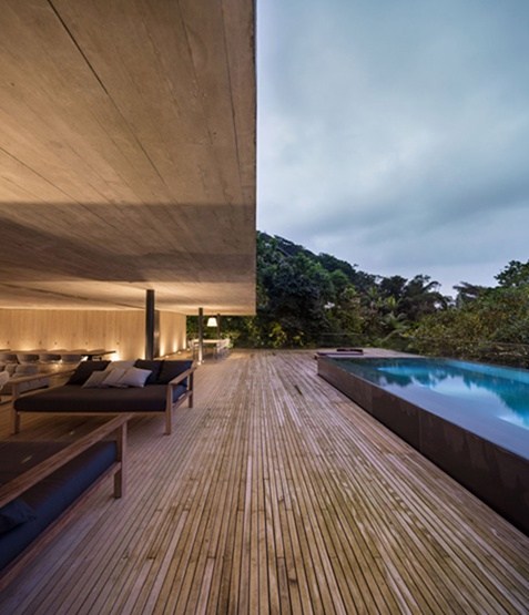 A residential pool with a swimming pool in the rainforest. Interesting interactions between nature and architecture.