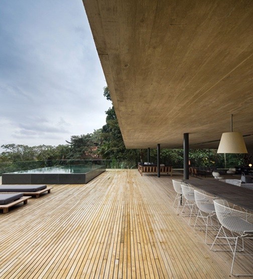 A residential pool with a swimming pool in the rainforest. Interesting interactions between nature and architecture.