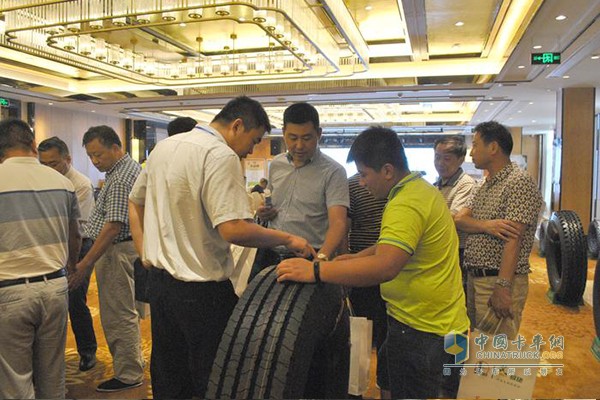Customer consults staff for tire product details