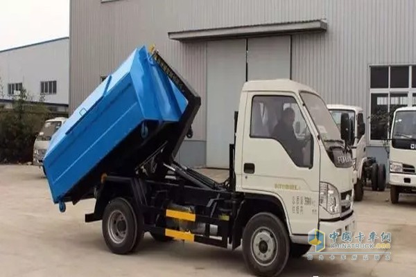 Hook arm garbage truck