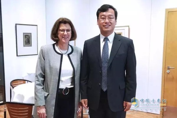 Chairman Wang Feng and Ou Kaixing, deputy director of risk control, Ms. Betsy Nelson