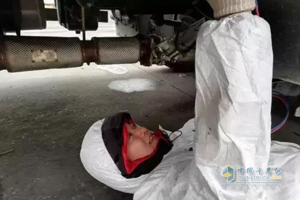 Engineers perform winter engine maintenance on the road