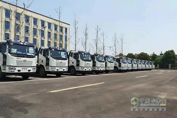 The vehicles are neatly arranged, waiting for delivery
