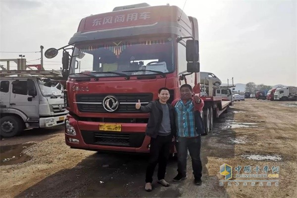 Dongfeng commercial vehicle with Dongfeng AMT gearbox and driver (first right)