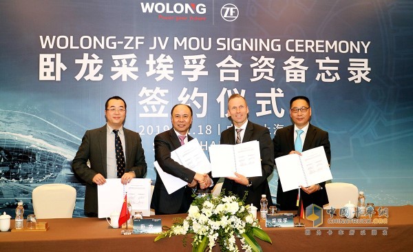 JÃ¶rg Grotendorst (third from left), head of the electric drive division of ZF Group, and Chen Jiancheng (second from left), chairman of Wolong Holding Group, Wu Jianbo (first from left), financial director of Wolong Electric Drive Group, and Zhee Dr. Ye Guohong, Vice President of Asia Pacific, Fushun Drive Division (right) signed the agreement