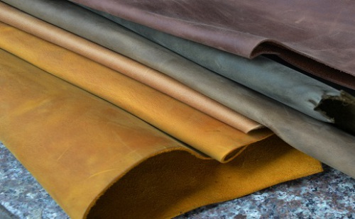 How should cow leather products be maintained?