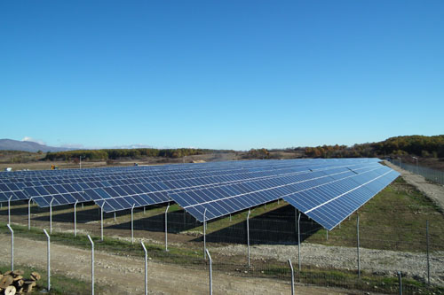 How do developers participate in the construction of photovoltaic power plants?