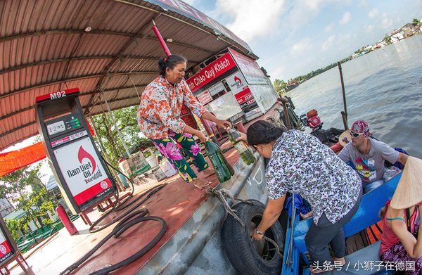 Gas station fuel injectors on the Mekong River directly poured into plastic bottles